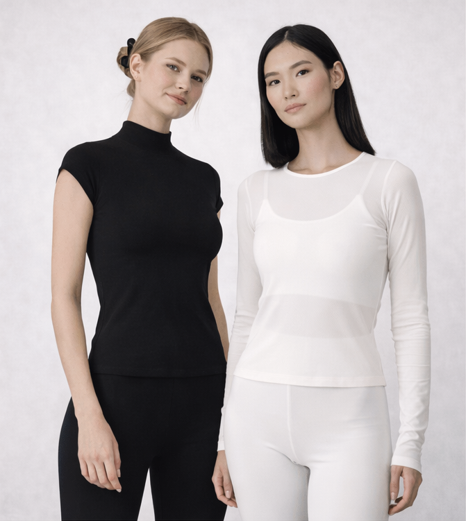 Two women wearing black and white long-sleeve shirts against a white background